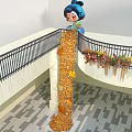 Popular Photo Spot With Giant Cartoon Head Golden Column And Floral Wreaths
