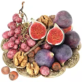 Assorted Fresh Fruits On Golden Plate With Grapes Figs Walnuts And Hazelnuts