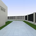 Building Exterior Wall Featuring Beige Pillars Black Vertical Slat Fence Green Grass Gray Stone Pavement