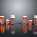 Household Medicine Bottles With Orange Bodies And White Caps In Various Sizes