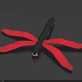 Colorful Dragonfly Doll With Black Body And Red Wings On Dark Background