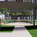 Courtyard Garden With Circular Pathway Green Lawn Stone Pavement Trees And Modern Building