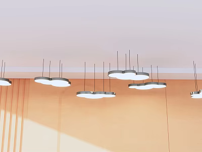 Cloud shaped white pendant lights hanging from ceiling with light colored wall and natural light 3d model