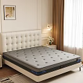 Gray Perforated Mattress On Bed Frame With White Tufted Headboard In Modern Bedroom