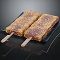 Crunchy Brown Coated Popsicles On Black Plate With Delicious Wooden Sticks