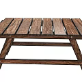 Wooden Outdoor Table With Slatted Top And Crossed Legs For Garden Use