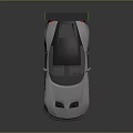 Silver Sports Car with Green Accents Red Alloy Wheels Black Rear Spoiler and Sleek Design