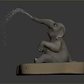 Gray Baby Elephant Sculpture Sitting On Light Base With Trunk Spraying Water Droplets