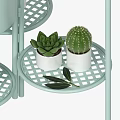 Modern Garden Decor With Golden Multi Tiered Plant Stands White Flowers And Green Foliage