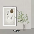 Transparent Glass Vase With Green Leaf Branches Against Light Colored Wall Background