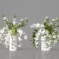 White Orchid Arrangement With Green Leaves and Small Blooms in White Vases for Home Decor
