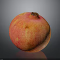Fresh Red Orange Pomegranate With Speckled Skin On Dark Background