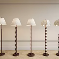 Elegant Floor Lamps With Light Shades Against Decorative Wall And Wooden Floor