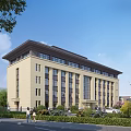 Beige Multi Storey Office Building With Modern Design Surrounding Greenery And Pedestrians
