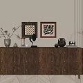 Wooden Brown Chest of Drawers with Framed Artworks Vase and Decorative Items in Minimalist Room