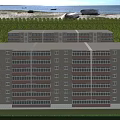 Twin Residential Buildings Exterior View With Central Pathway Green Landscaping Trees And Blue Sky