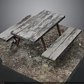 Weathered Wooden Picnic Table With Benches On Outdoor Dirt And Gravel Ground