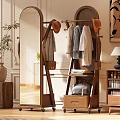 Wooden Mirror With Coat Rack Hanging Hats And Clothes In Interior