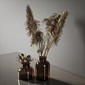 Brown Glass Vases With Dried Pampas Grass And Decorative Elements In Neutral Gray Interior