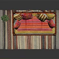 Single Bed With Wooden Frame Hanging Tassels Colorful Striped Pillows And Striped Rug