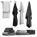 Assorted Colored Soft Cotton Towels Hanging And Folded In Bathroom