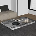 Sleek Marble Coffee Table In Modern Living Room With Decorative Plates And Glasses