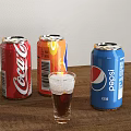 Three Branded Carbonated Soda Cans with Glass of Dark Drink on Wooden Table