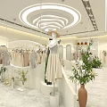 Stylish Clothing Store With White Interior Mannequins Hanging Clothes And Plants