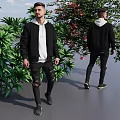 Man Wearing Black Jacket White Hoodie with Ripped Jeans Near Green Plants Pink Flowers