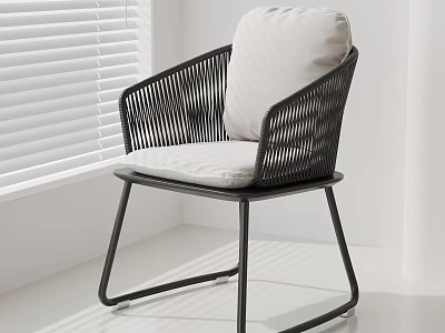 Modern Minimalist Rattan Leisure Chair With Black Frame And Light Cushion In Bright Room 3d model
