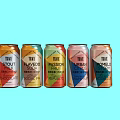 Vibrant Canned Flavored Drinks With Various Fruit Tastes On Light Blue Background