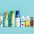Assorted Colorful Bathroom Accessories Including Personal Care Products on Light Blue Background