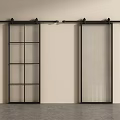 Black Framed Sliding Barn Doors With Grid And Ribbed Glass Panels On Light Colored Wall