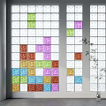 Vibrant Glass Wall with Colorful Square Patterns and Bamboo Plant Accent