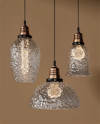 Three Vintage Pendant Lights With Textured Glass Shades And Brass Bases Glowing Warmly 3d model