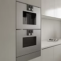 Modern Built in Stainless Steel Kitchen Appliances With White Cabinets And Countertop