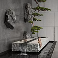 Modern Water Fountain with Hanging Rocks Potted Pine Tree Gray Wall Stone Platform and Water Flow