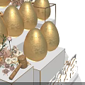 Golden Eggs Display On White Tiered Platform With Decorative Flowers And Gift Boxes