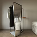 Modern Floor Mirror Reflecting Room Interior With Shelf Decorations Hanging Clothes And Black Shoes