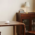 Modern Dining Area With Wooden Table And Chairs Pendant Light Framed Art And Green Plant