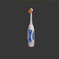 Electric Toothbrush With White And Blue Ergonomic Grip Handle And Soft Bristle Head
