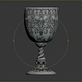Decorative Ornate Metallic Goblet With Intricate Floral Patterns And Twisted Base