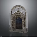 Classical Architectural Doorway Featuring Arched Top Intricate Carved Details And Wooden Panel Door