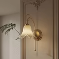 Elegant Golden Wall Sconce with White Striped Lampshade on Light Wall and Fern Plant