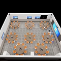 School Multi Purpose Room With Round Tables Orange Chairs And Wall Mounted TV Screens