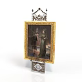 Decorative Golden Frame With Two Figures Inside Ornate Top Structure And Base Featuring Geometric Pattern