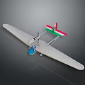 White Model Airplane With Long Wings Red Green Tail And Blue Cockpit