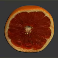 Sliced Grapefruit With Vibrant Red Flesh And Yellow Peel On Dark Background