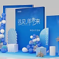 Brand Welcome Event Setup With Blue White Balloons Striped Decorations Flower Arrangements And Brand Logo