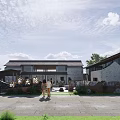 Traditional Homestay Building With Courtyard Trees Two People And Blue Sky White Clouds